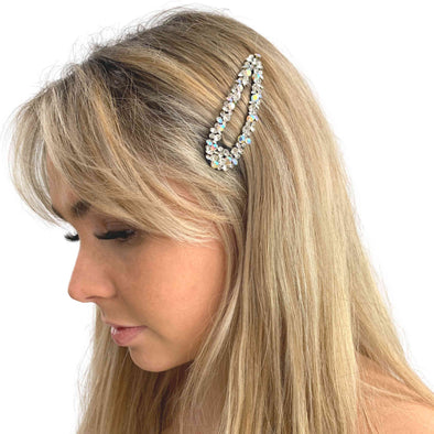 Girl wearing crystal hair clip set on a well-made sturdy back.