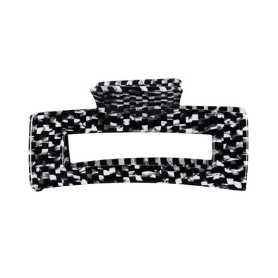 Image of black and white check pattern hair claw on a white background