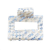 Image of blue and white check pattern (daydream) small square hair claw on white background