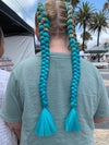 Girl wearing jumbo hair braid in teal.