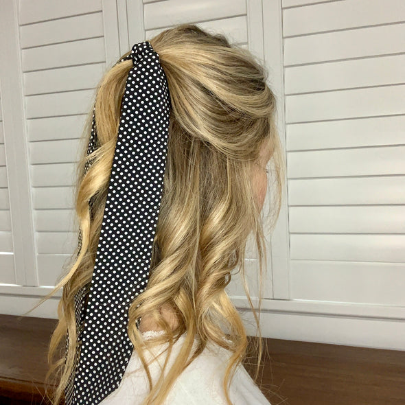 Girl wearing gorgeous black fabric with mini white spot design hair scarf