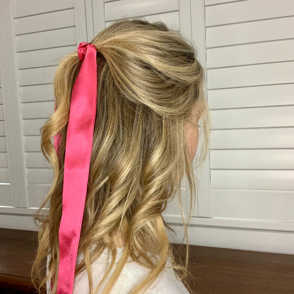 Girl wearing gorgeous pink hair scarf.