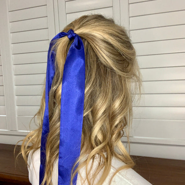Girl wearing gorgeous royal blue hair scarf.