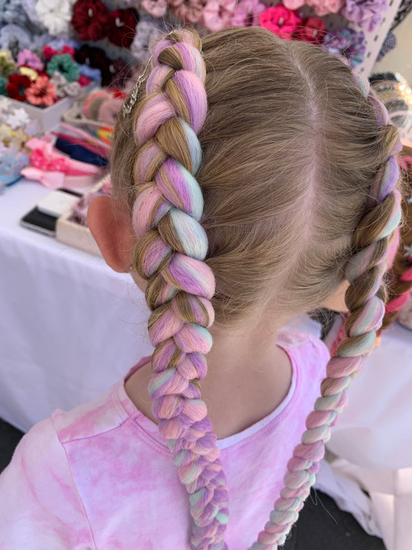 Jumbo hair braid in Pink, Purple, Light Mint Green. Measurements: Each strand is 48 inches long.