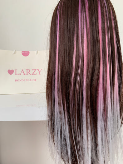 Ladies head with pink ombre clip-in hair extension.