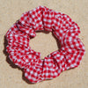 Red - Picnic 4 2 Scrunchie. Colour/Pattern: Red and white gingham. Material: Cotton. Dimensions: Material width approximately 4cm. Made by us in Bondi Beach.