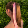 Girl wearing gorgeous pale pink hair scarf.