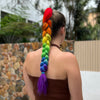 Girl wearing rainbow colour hair extension on elastic.