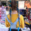 Girl wearing jumbo hair braid in Green, Navy & Blue. Measurements: Each strand is 48 inches long.