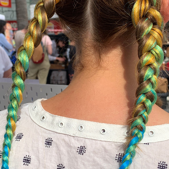 Girl wearing jumbo hair braid in Yellow, Green & Aqua. Measurements: Each strand is 48 inches long.