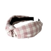 Top notch headband in pink/cream check pattern.