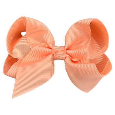 Apricot hair bow made with grosgrain ribbon.