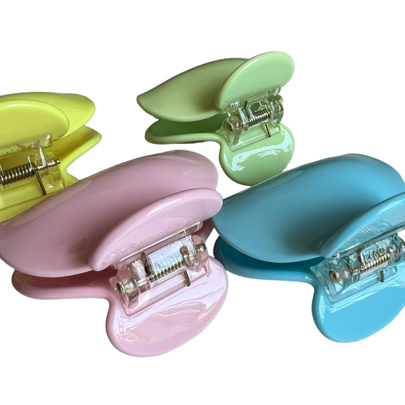 Addison mini hair claws in blue, pink, green and yellow.