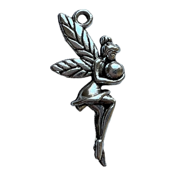 Tinkerbell (fairy) hair charm in silver colour.  Fairy has wings and is holding a ball.