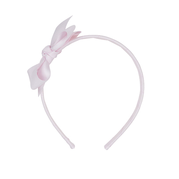 Baby pink headband with bow.
