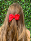 Girl wearing red bow. Size: 100mm x 80mm (approx 3 1/2 inches). Ribbon width: 37mm.
