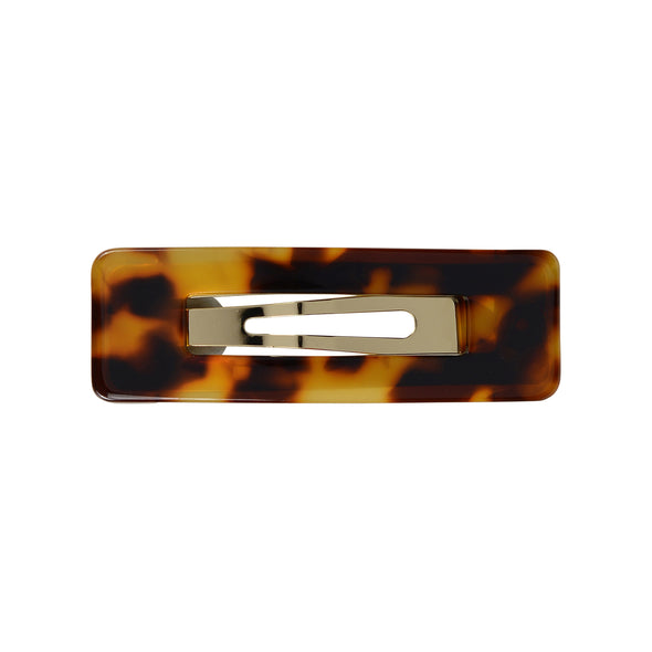 Tortoiseshell rectangle hair clip set on gold toned base.