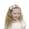 Girl wearing white headband with bow.