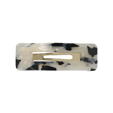 Black/white tortoiseshell small rectangle hair clip with a gold coloured base.