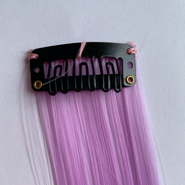 Clip in purple (lilac) hair extension. Measurements: 50cm x 3.5cm. Soft synthetic fibre hair.